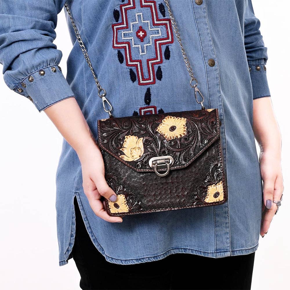 Hand-Tooled Leather Messenger Bag with Floral Design & Chain Strap