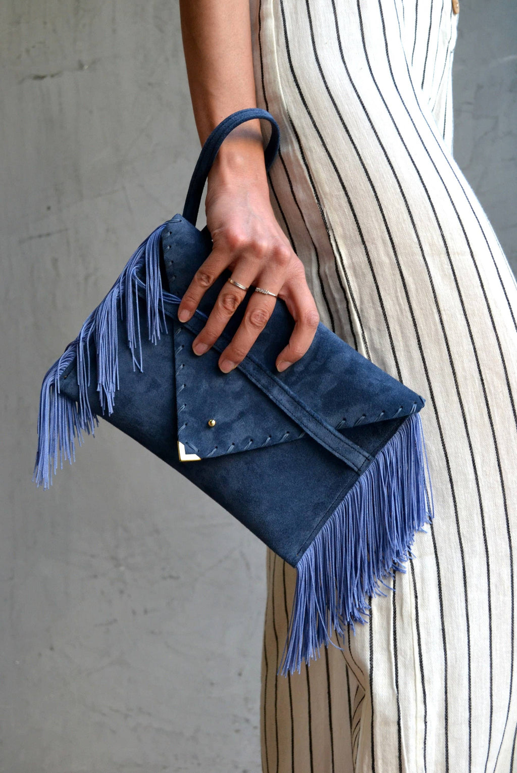 Leather clutch in raf blue with silk fringes